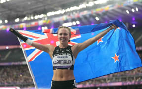 Anna Grimaldi of New Zealand celebrates winning bronze in Women's 100m - T47 Final during the Paris 2024 Paralympic Games at Stade de France on September 3, 2024. (Photo by Ulrik Pedersen/NurPhoto) (Photo by Ulrik Pedersen / NurPhoto / NurPhoto via AFP)