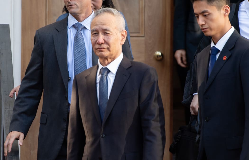 Chinese Vice Premier Liu He (C) departs during trade talks with the US Secretary of Treasury and US Trade Representative at the office of the US Trade Representative in Washington, DC, October 10, 2019.