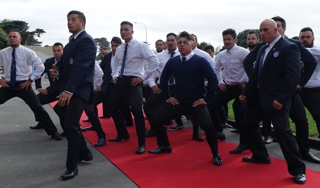 Members of the Northern United Rugby Club perform a haka at the ceremony.