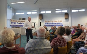 Julian Batchelor addresses mtg in Kerikeri