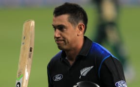The Black Caps batsman Ross Taylor waves his bat on making his century.