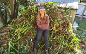 Holly Neill with agapanthus she dug up from her garden