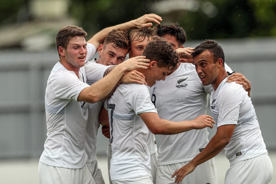 Members of the New Zealand Under 23 football side celebrate during their match against Solomon Islands in Fiji.