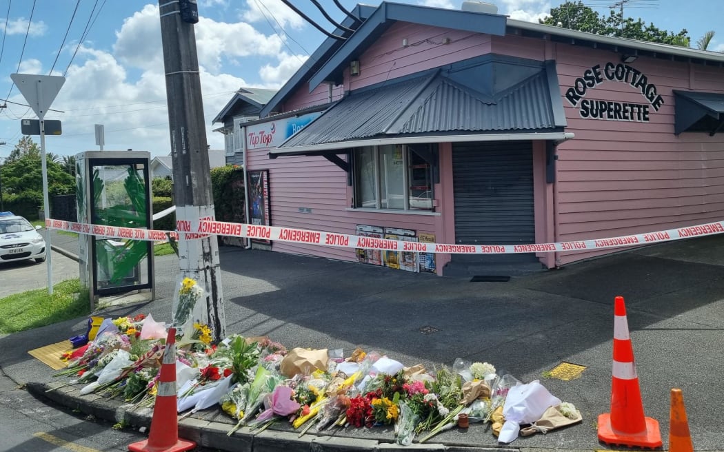 Flowers are seen outside Rose Cottage Superette in Sandringham, Auckland, after the fatal stabbing of a dairy worker on Wednesday, 23 November, 2022.