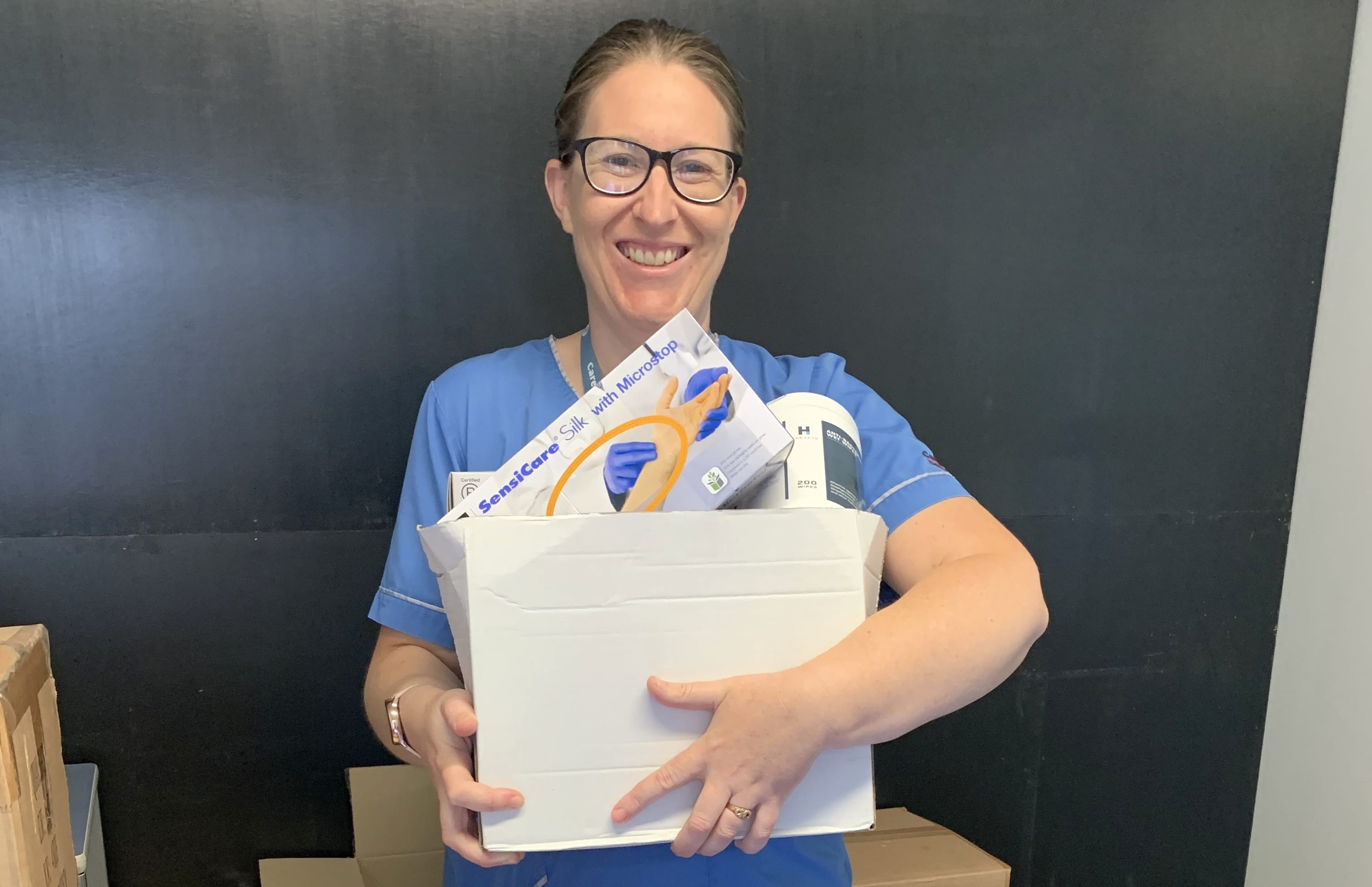 Nurse, Kerry Winchester, sorting supplies for the nurses she oversees, who work at Christchurch Managed Isolation hotels.