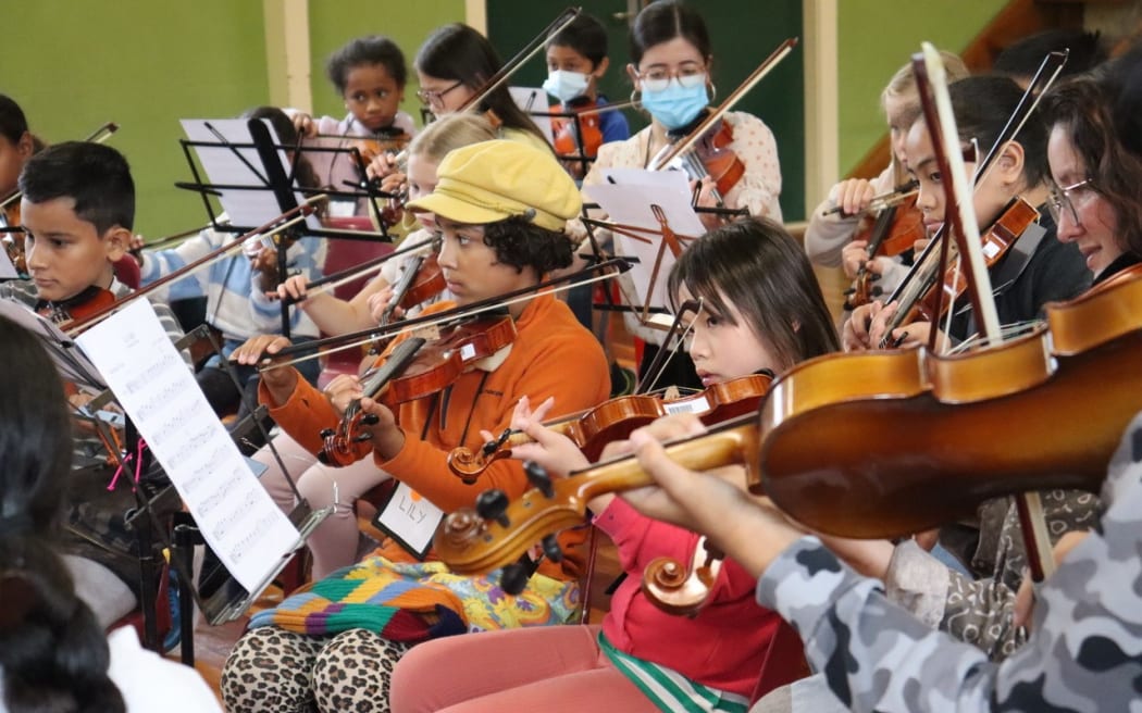 Performers from Arohanui Strings play their violins during a holiday programme in April 2023.