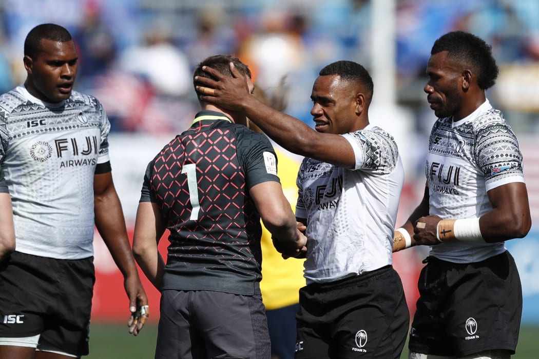 Fiji's Livai Ikanikoda and England's Will Hendy shake hands after the Cup semi final in Los Angeles.