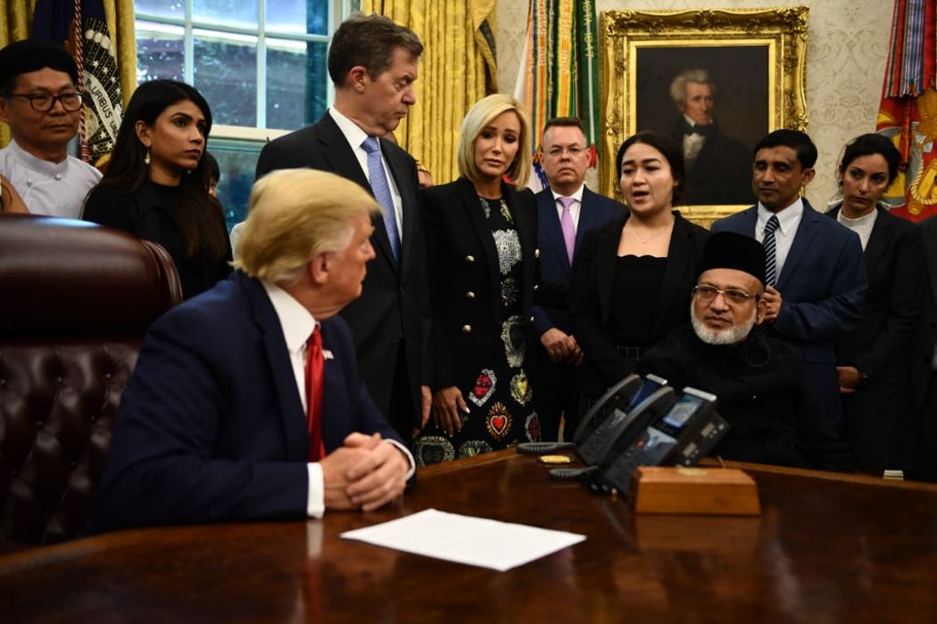 US President Donald Trump meets with survivors of religious persecution (Farid Ahmed, sitting right).