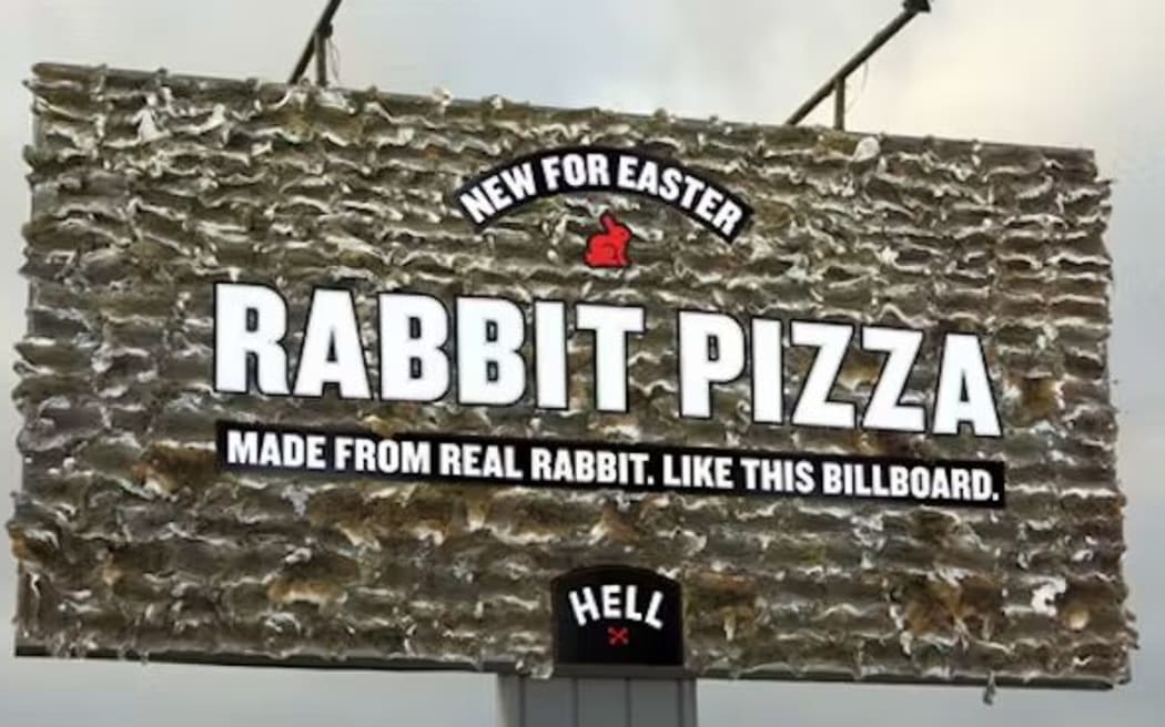 A Hell Pizza billboard advertising rabbit pizza.