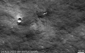 This handout picture taken on August 24, 2023 by the Lunar Reconnaissance Orbiter Camera (LROC) and made available by NASA’s Goddard Space Flight Center/Arizona State University on August 31, 2023 shows a new impact crater on the Moon's surface (center) likely from Russia’s Luna 25 mission. The Luna-25 module has crashed on the Earth's natural satellite after an incident during pre-landing manoeuvres, the Russian space agency Roscosmos said on August 20, 2023. (Photo by NASA’s Goddard Space Flight Center/Arizona State University / AFP) / RESTRICTED TO EDITORIAL USE - MANDATORY CREDIT "AFP PHOTO / NASA’s Goddard Space Flight Center/Arizona State University " - NO MARKETING NO ADVERTISING CAMPAIGNS - DISTRIBUTED AS A SERVICE TO CLIENTS