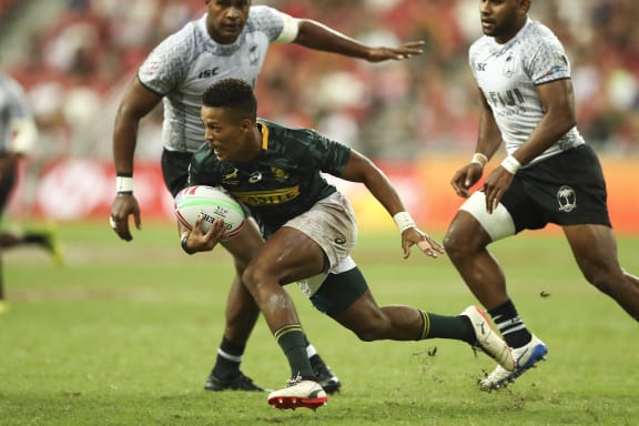 Player of the final Angelo Davids cuts through the Fiji defence.