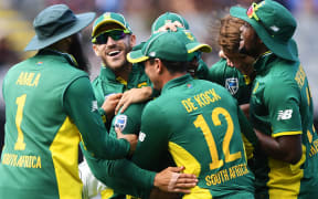 South Africa celebrate the run out of Mitchell Santner.