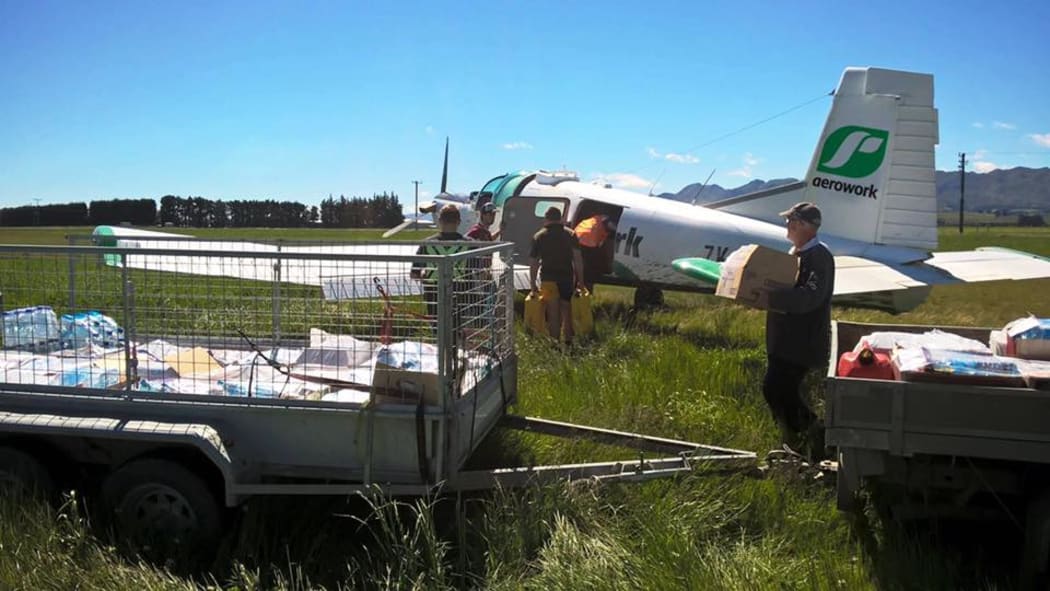 A plane is loaded up to get supplies out to farmers.