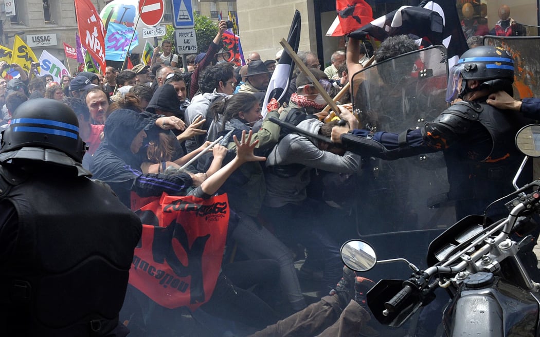 Security forces clash with demonstrators during a protest called by seven labour unions and students in Bordeaux, southwest France.