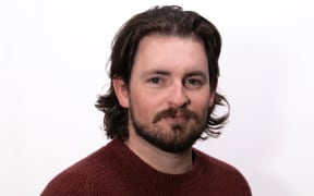 Head shot of Ben Strang, host of the Paris Essentials Podcast