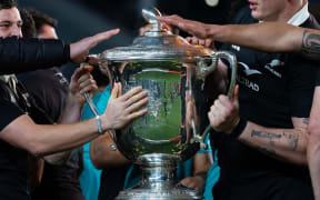 The All Blacks celebrate winning the Bledisloe Cup.