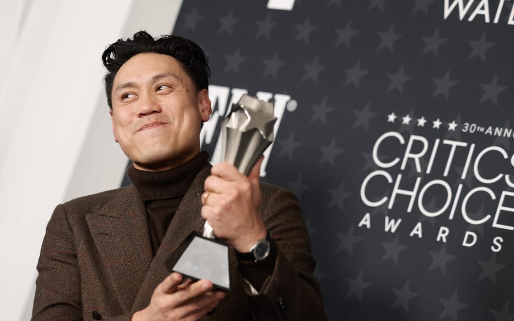 SANTA MONICA, CALIFORNIA - FEBRUARY 07: Jon M. Chu, winner of the Best Director Award for “Wicked”, poses in the press room during the 30th Annual Critics Choice Awards at Barker Hangar on February 07, 2025 in Santa Monica, California.