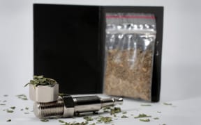 Synthetic cannabis and a pipe.