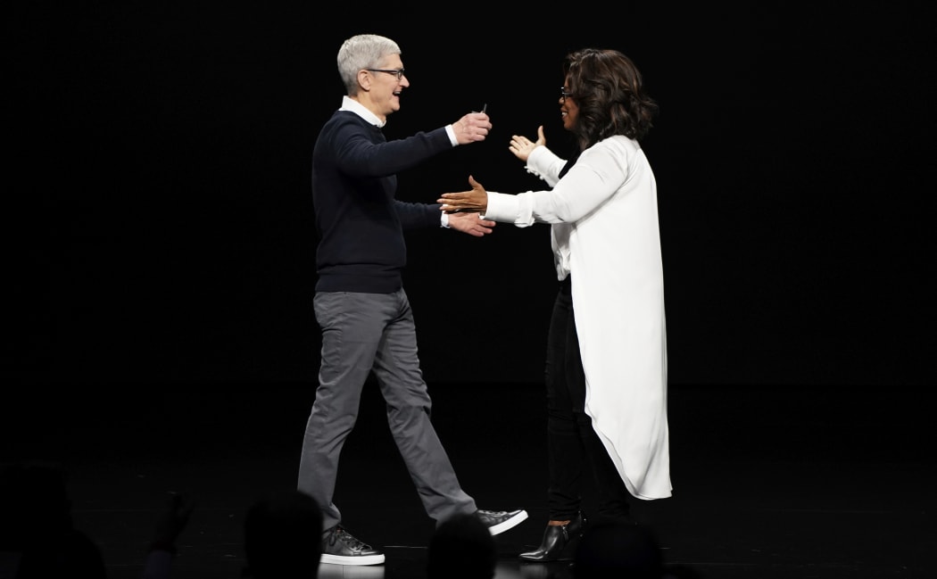 Apple CEO Tim Cook and Oprah Winfrey during an event at the Steve Jobs Theatre to unveil its new streaming platform. March 25, 2019, in Cupertino, Calif.