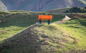 Gareth Morgan's giant park bench sculpture as seen from Transmission Gully July 2025 - ahead of the opening of his public art trail.