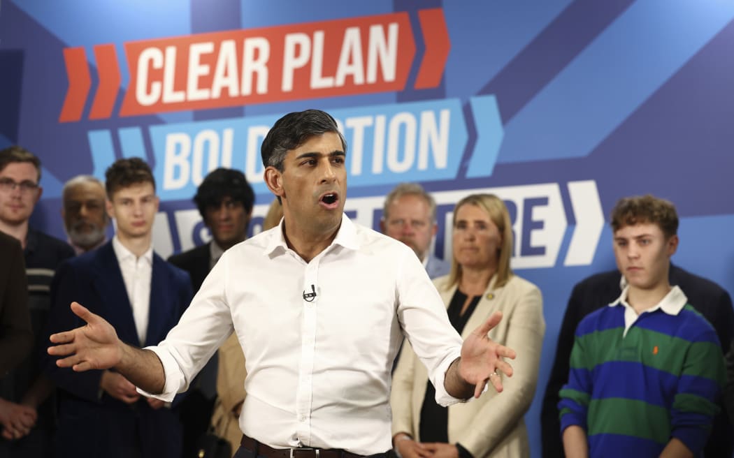 FILE - Britain's Prime Minister and Conservative Party leader Rishi Sunak, delivers a speech as part of a Conservative campaign event in the build-up to the UK general election on July 4, in Leeds, northern England, Thursday, June 27, 2024. The United Kingdom will hold its first national election in almost five years on Thursday, with opinion polls suggesting that Prime Minister Rishi Sunak’s Conservative Party will be punished for failing to deliver on promises made during 14 years in power.  (Darren Staples/Pool Photo via AP, File)