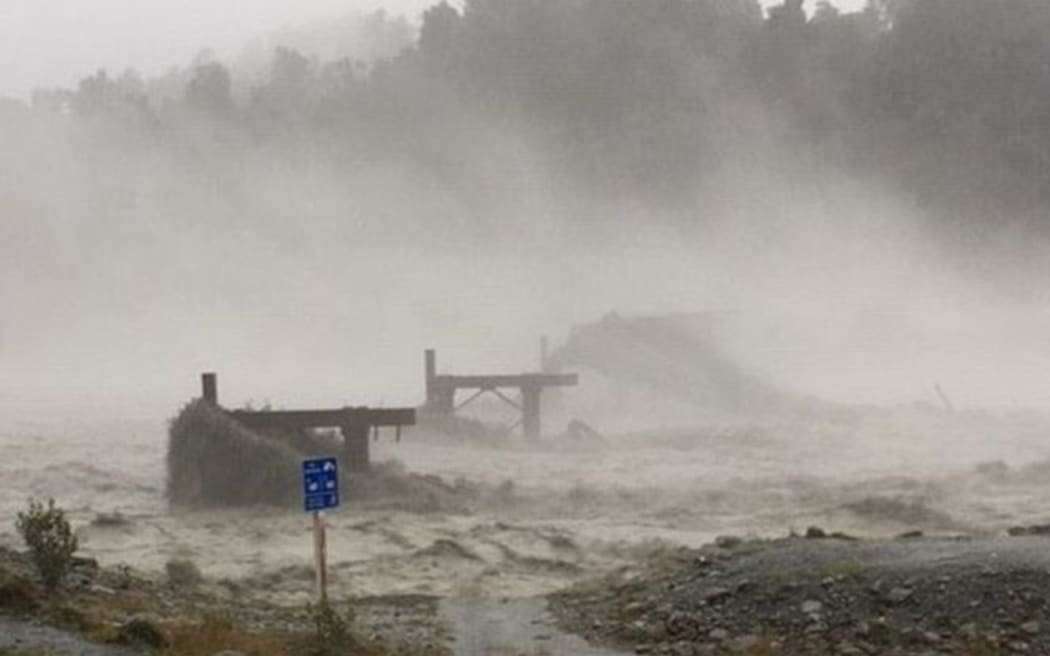 The Waiho Bridge has been totally taken out by the raging floodwaters.