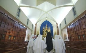 The nuns at the top of the billboards