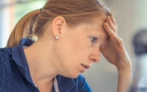 tired woman at computer