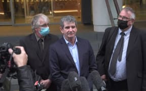 Alan Hall's brothers Greg, Geoff and Robert speak outside the Supreme Court.