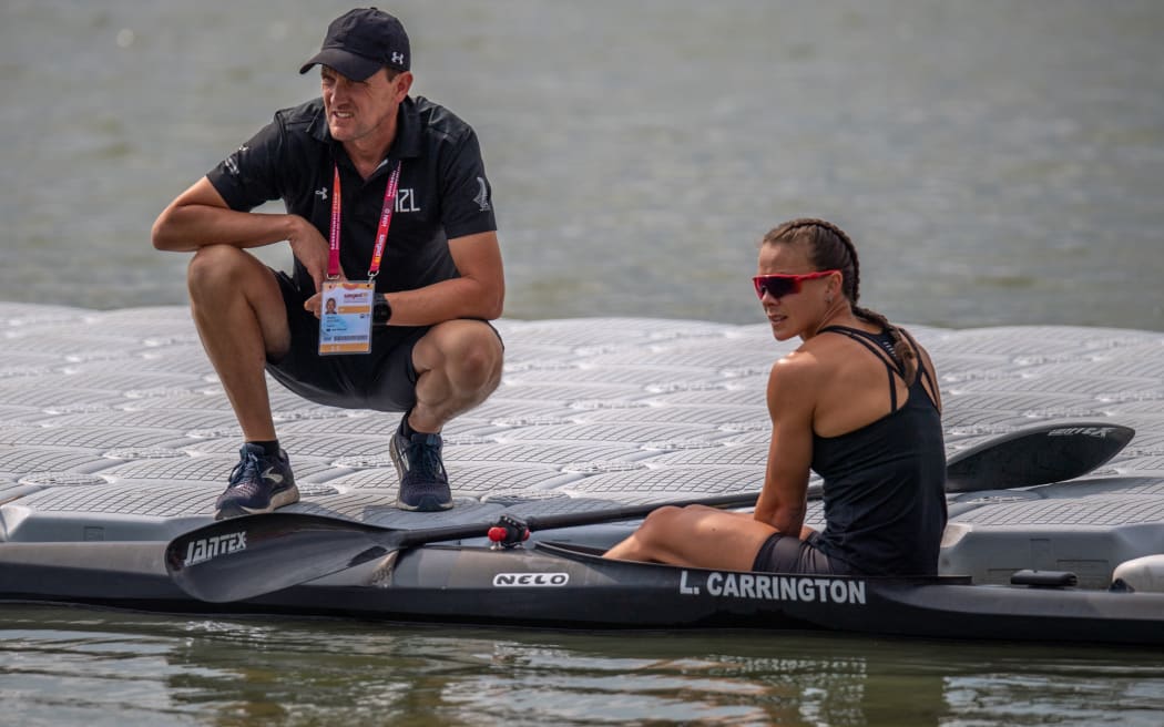 Coach Gordon Walker and Dame Lisa Carrington.