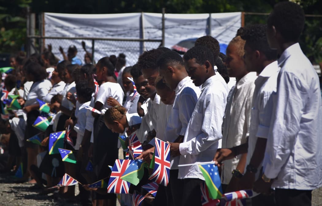Students lined up to welcome the Prince of Wales in the Solomon Islands capital Honiara.