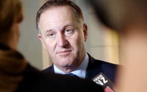 John Key speaking to media in Auckland.