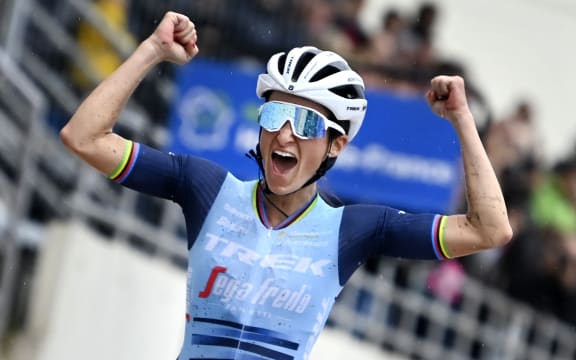 UK's Elizabeth Lizzie Deignan celebrates as she crosses the finish line to win the first edition of the women elite race of the 'Paris-Roubaix' cycling event, 116,5km from Denain to Roubaix, on October 2, 2021.