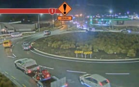 An overturned car on the Harewood roundabout, Christchurch, after a crash on 9 May 2022.