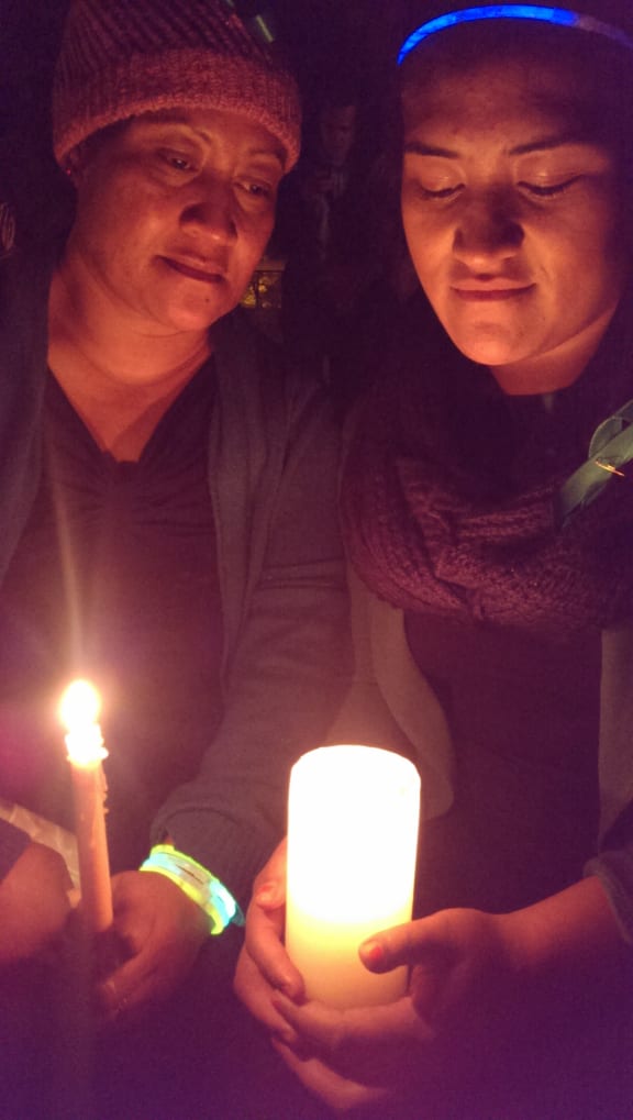 Mourners at a night walk in memory of Blessie Gotingco.