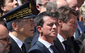 The mayor of Nice Philippe Pradal, Prefect of the Alpes-Maritimes department Adolphe Colrat, French Prime minister Manuel Valls and President of the Provence Alpes Cote d'Azur region Christian Estrosi observe a minute of silence on the Promenade des Anglais in Nice on July 18, 2016,