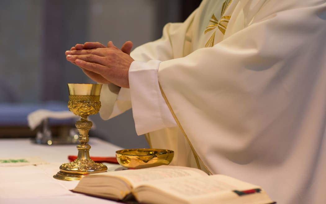 Priest during a wedding ceremony/nuptial mass