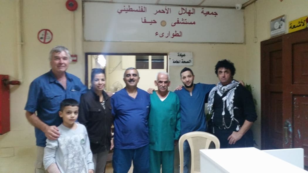 Warren Marriner (right) with hospital staff.