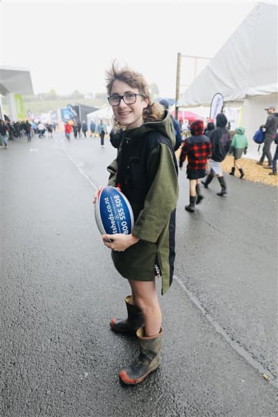 Jackson Greathead, from Bombay, is sporting a mullet and holding a rugby ball at Fieldays on 12 June, 2025.