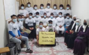 Afghan students taught English by New Zealand troops.