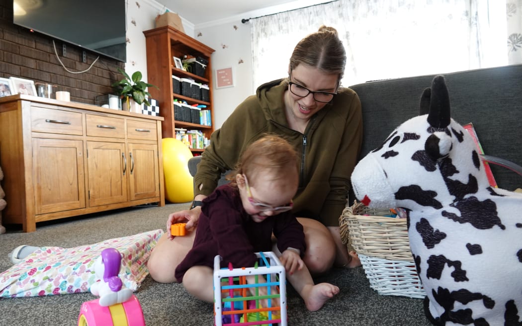 Julia Tiffen plays with her mother Nikita at their Palmerston North home.
