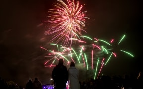 People watch fireworks during New Year's Eve celebrations in Christchurch on 1January 2021. 