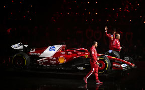 (From L) Ferrari's British driver Lewis Hamilton, Ferrari's French team principal Frederic Vasseur and Ferrari's Monaco driver Charles Leclerc at the 2025 Formula 1 season launch in London.