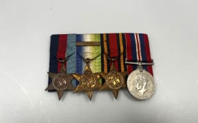 The medals include a 1939-1945 star, an Atlantic star, a Burma star, and the 1939-1945 war medal.