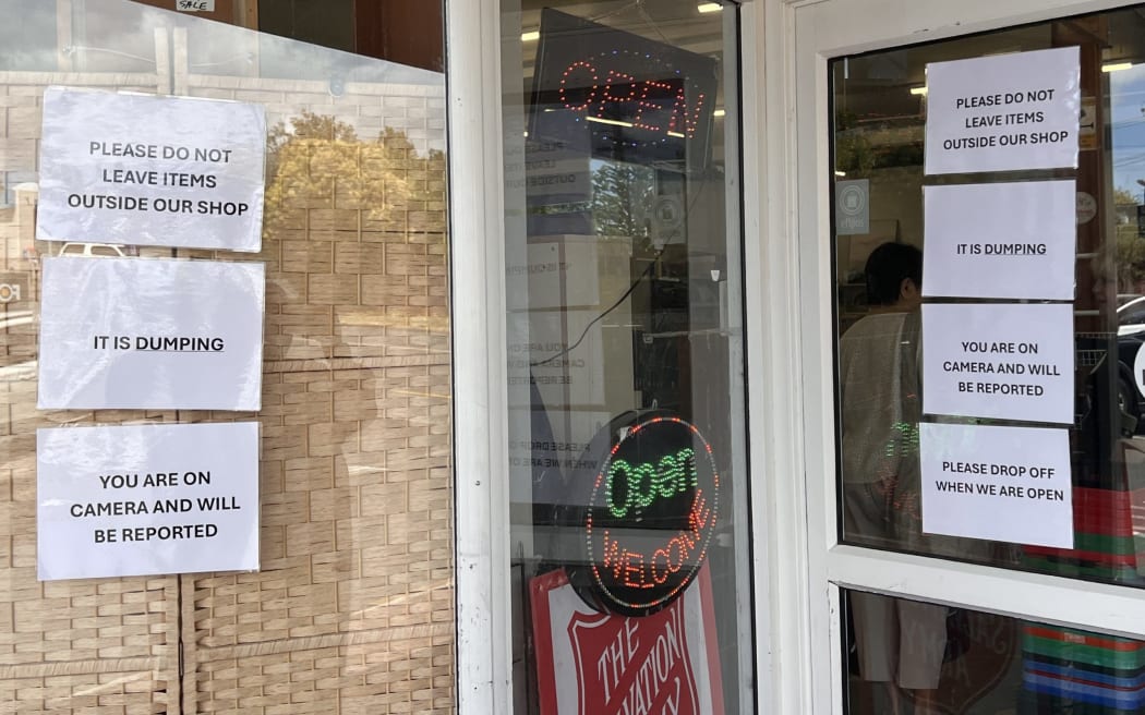 Signs on the shops front windows warn of the public not to leave items as it is dumping and they will be reported.
