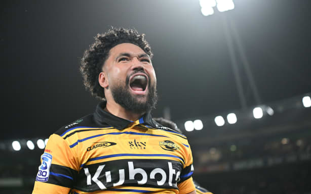 Fehi Fineanganofo of the Hurricanes celebrates his record breaking try.