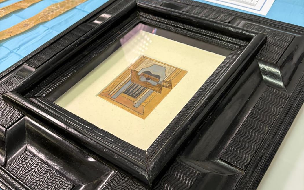 This handout image released by Spanish National Police on October 24, 2025 shows "Still Life with Guitar", a 1919 gouache and pencil work by Pablo Picasso valued at around 600,000 euros ($700,000), which has been found by police after disappearing in early October. Spanish police said on October 24, 2025 that a Pablo Picasso painting that vanished en route to an exhibition has been found, raising doubts if it was ever loaded onto a transport truck.