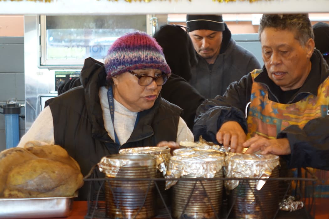 Daisy Noble checks on the hangi.