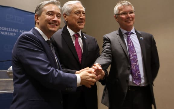 New Zealand's Trade and Export Growth Minister David Parker (R), Chile's Foreign Minister Heraldo Munoz (C),  and Canada's Trade Minister Francois-Philippe Champagne pose before signing the CPTPP in Santiago.
