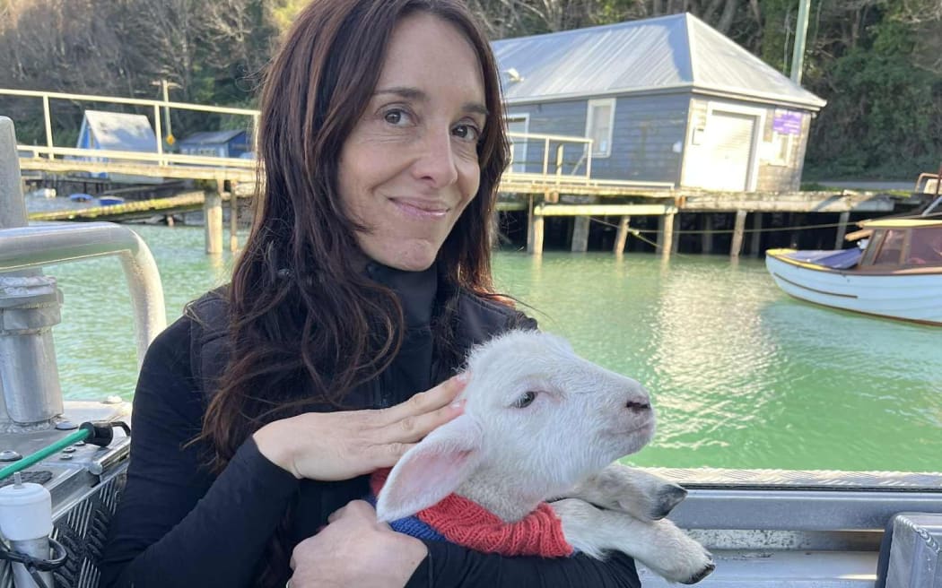 Port to Port Cruises operator Rachel McGregor with her first lamb passenger Dave.